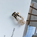 FORCE Großes Hufeisen-Armband mit schwarzen und weißen Diamanten – Roségold